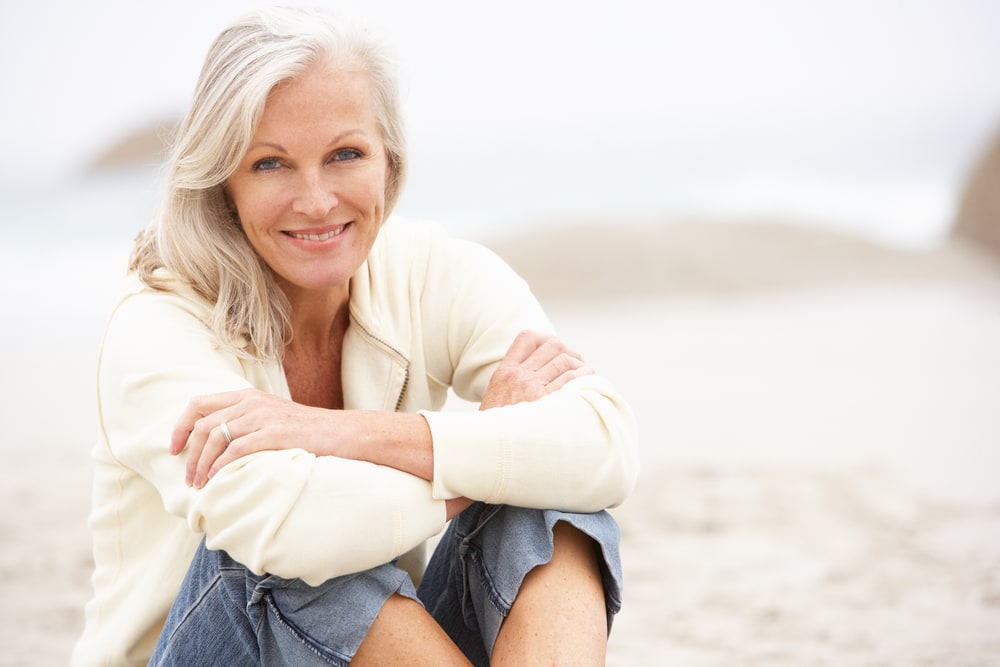 woman-sitting-on-the-beach