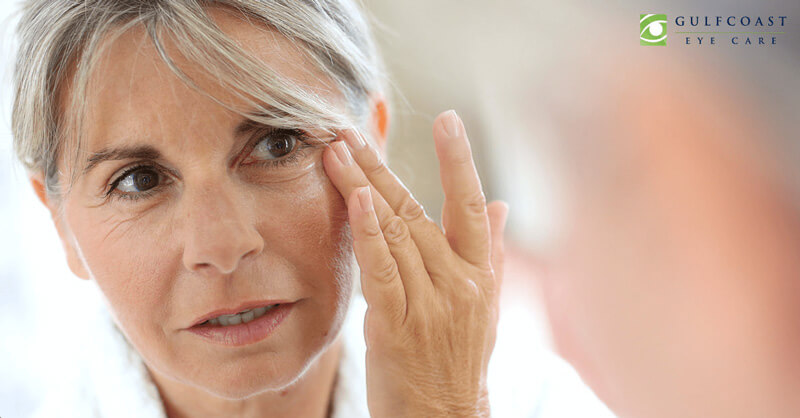 woman looking at her wrinkles