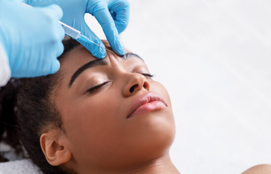 woman taking injection at Gulfcoast Eye Care