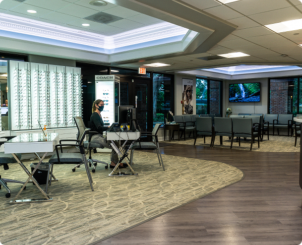 Image of the inside of a beautiful location. a large wall of glasses on the left and a comfortable waiting area to the right. Gulfcoast Eye Care, The Leading Vision Correction Practice for the Tampa Bay and St. Petersburg Areas 