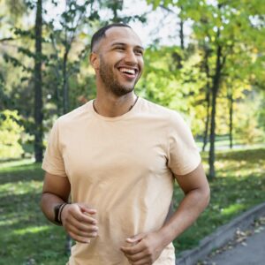Man jogging smiling