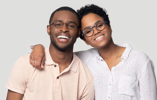 Happy couple wearing stylish eyewear from Gulfcoast Eye Care